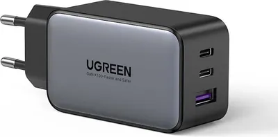 A close-up studio shot of a black and gray UGREEN GaN charger with multiple ports.