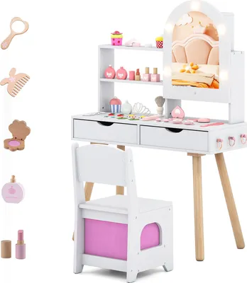 A white wooden children's vanity table with a mirror, drawers, and accessories, along with a matching chair. The vanity has LED lights around the mirror and is set against a white background.
