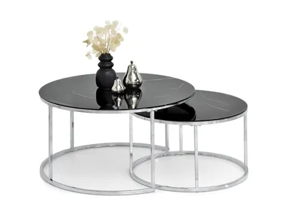 A set of two nesting coffee tables with black marble tops and chrome legs, displayed on a white background.