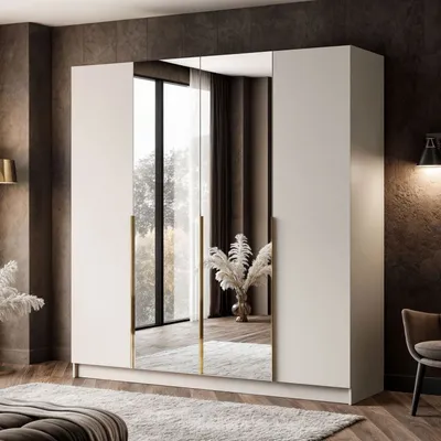A modern bedroom with a large wardrobe featuring mirrored doors and golden handles.