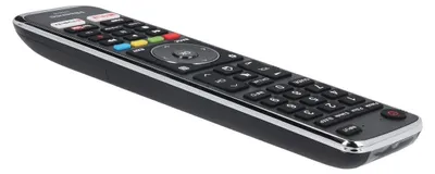 A black remote control with silver trim is shown against a white background.