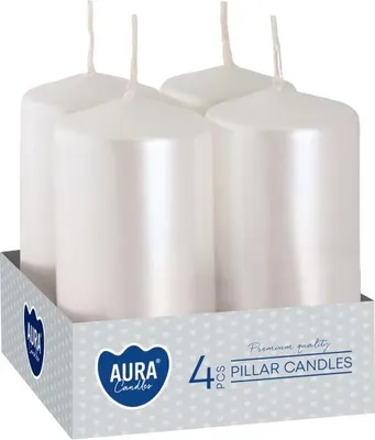 Four white pillar candles in a cardboard box.