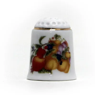 Zdjęcie produktu dla Porcelanowy naparstek w kolorze żółtym z motywami kuchennymi i złotą obwódką