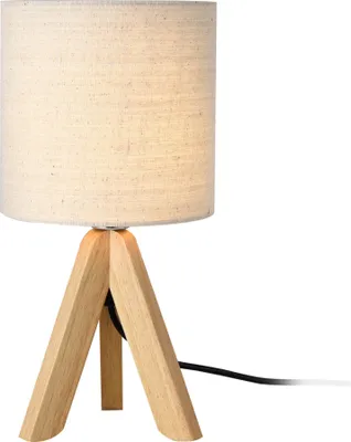 A table lamp with a linen shade and wooden tripod legs, shown against a white background.