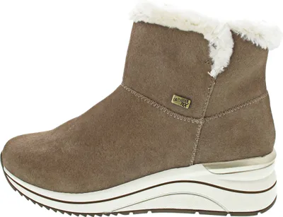 A side view of a beige boot with white fur trim.
