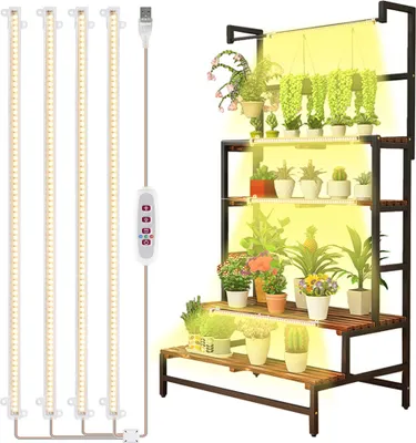 A multi-tiered plant stand with grow lights, showcasing various potted plants.