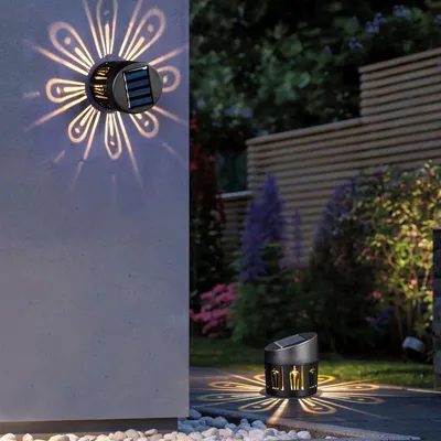 Produktbild von Dekorative Solar-Wand- und Stehleuchte mit warmweißen LEDs – Solar-Gartenleuchte für Wand oder Boden – Atmosphärische Schattenbeleuchtung mit automatischem Dämmerungssensor – Energieeffiziente LED-Außenbeleuchtung 8 x 9 cm [11784]
