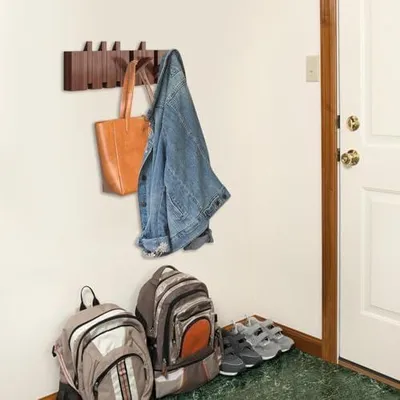Produktbild von Klavier-Wandgarderobe mit Holzhaken und Paneeldesign, musikalisch inspirierte Wandstruktur, mehrere Haken und dekorativer Rahmen – ideal als Organisationstuch für den Eing