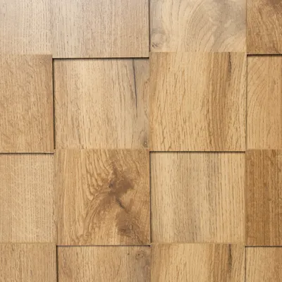 A close-up, textured view of a wooden surface with a repeating pattern of square panels.