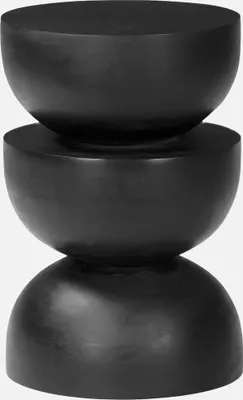 A black, three-tiered side table with a rounded, sculptural design.