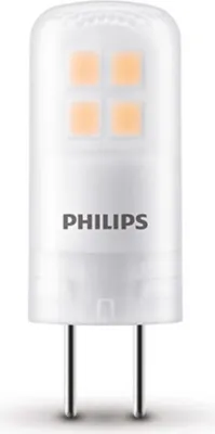 A close-up studio shot of a Philips LED light bulb with two metal prongs.