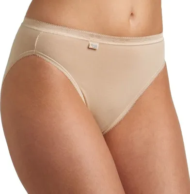 Close-up of a woman's lower torso wearing beige underwear.