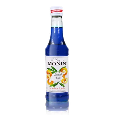 A bottle of Monin Curacao Blau syrup on a white background.