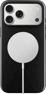 The back of a black iPhone case with a white MagSafe charger attached.