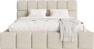 A beige upholstered bed with white bedding and a throw blanket.