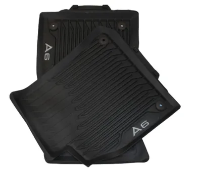 A set of black rubber floor mats for an Audi A6.