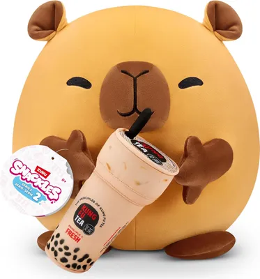 A plush toy capybara holding a bubble tea cup.