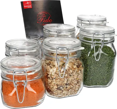 A set of glass jars with metal clasps and lids, some filled with food items, and a product information card.