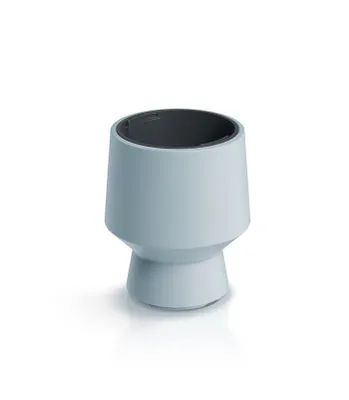 A light blue planter with a dark gray interior sits on a white surface with a subtle shadow.