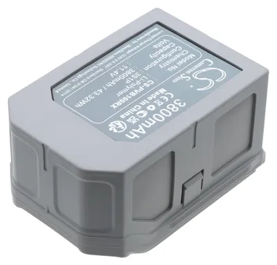 A close-up, angled view of a gray battery pack with a label showing product specifications.