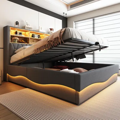 A modern upholstered bed with its storage compartment open, revealing stored items and illuminated by LED lighting.