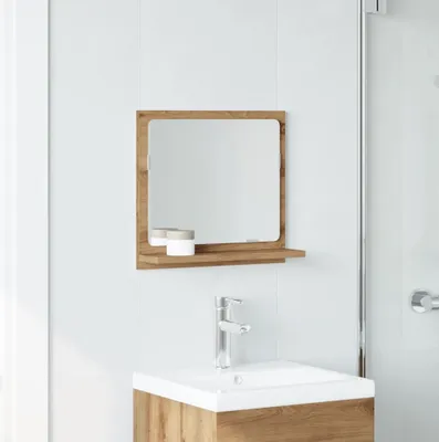 A bathroom vanity with a mirror and sink.