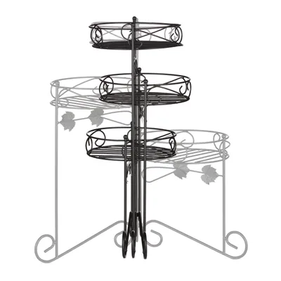 A three-tiered metal plant stand with a black finish, shown against a white background. The stand has decorative scrollwork and leaf motifs.