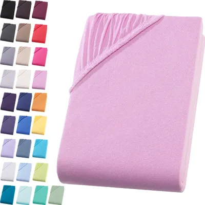 A pink fitted sheet is shown folded, with a swatch of other colors displayed to the left.