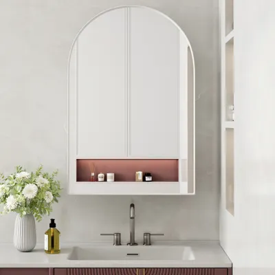 A bathroom vanity with a sink and a medicine cabinet.
