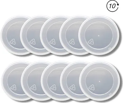 A top-down view of multiple clear plastic lids arranged in two rows on a white background.