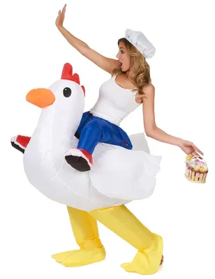 A woman wearing an inflatable chicken costume and a chef's hat, holding a cupcake.