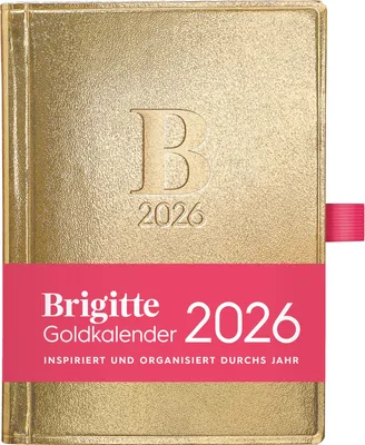 A gold-colored planner with a pink band across the front.