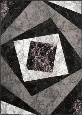 A geometric rug with concentric squares in shades of gray, black, and white.