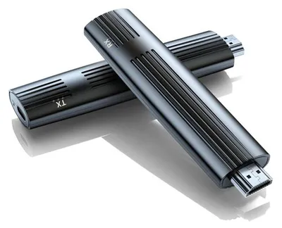 Two dark gray HDMI extenders are placed diagonally on a white background.
