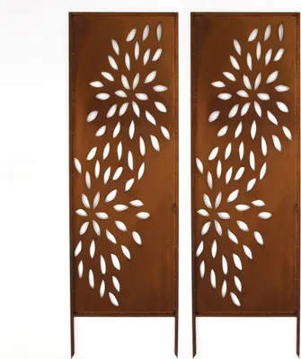 Two decorative metal screens with a floral cut-out pattern, standing upright on thin legs.