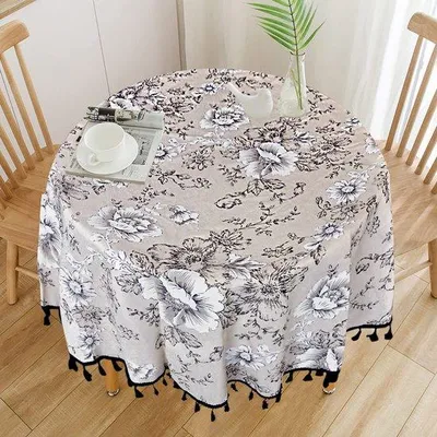 Imagen del producto de Mesa redonda Unyqoos® de 150 cm – algodón/lino, impermeable, suave y transpirable, con estampado floral, fácil de cuidar y lavable, color beige con borlas negras
