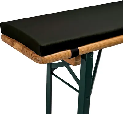 A close-up view of a black cushion on a wooden bench with green metal legs.