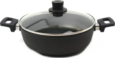 A black frying pan with a glass lid and silver handles is shown against a white background.
