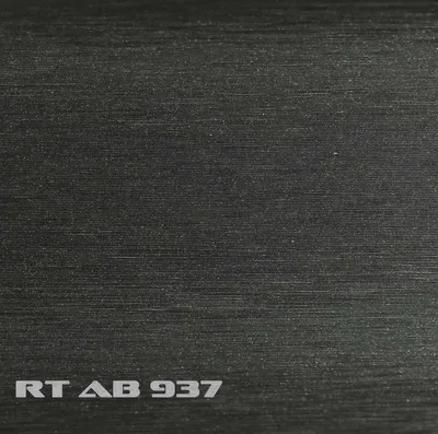 A close-up of a brushed aluminum surface with text.