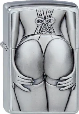 A close-up, front-facing view of a Zippo lighter with an embossed design of a woman's posterior in lingerie.