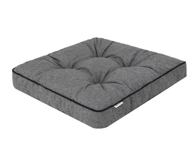 A single dark gray tufted seat cushion with black piping, shown from a slightly elevated angle on a white background.