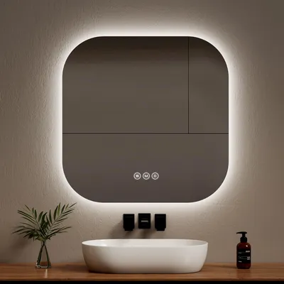 A modern bathroom vanity with a sink, faucets, and a lit mirror.