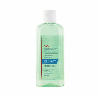 A bottle of shampoo on a white background.