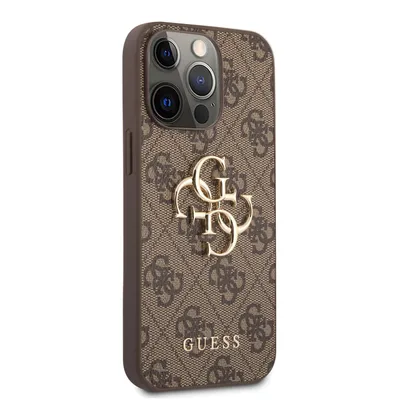 A close-up view of a brown iPhone case with a repeating Guess logo pattern and a large gold Guess logo emblem.
