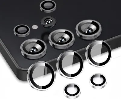A collection of camera lens protectors arranged on a dark surface and a white surface.