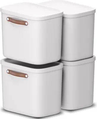 Four white storage boxes are stacked in a two-by-two configuration against a white background.