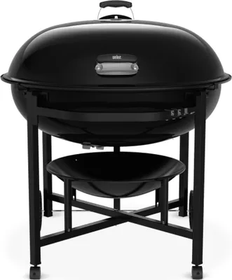A black Weber kettle charcoal grill is shown from the front on a white background.