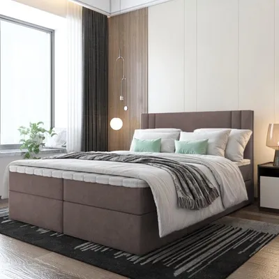 A bedroom scene with a bed, window, and bedside table.