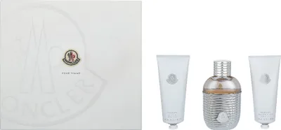A product shot of a Moncler fragrance set, including a gift box and three individual perfume bottles/tubes.