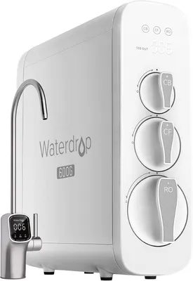 A white under-sink water filtration system with a silver faucet.